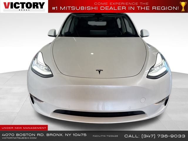 Used 2022 Tesla Model Y Long Range with VIN 7SAYGDEE2NA010323 for sale in Bronx, NY