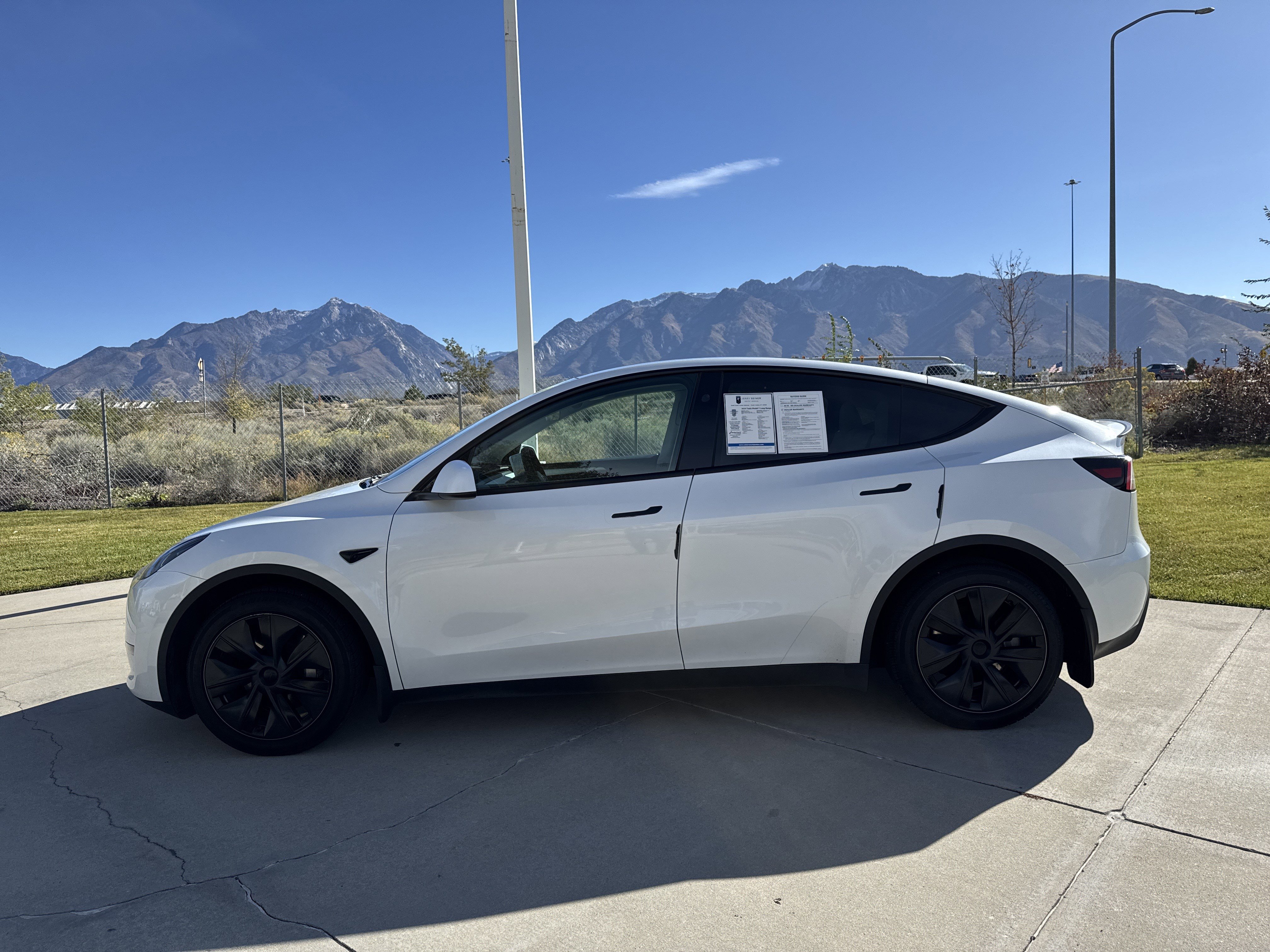 Used 2024 Tesla Model Y Long Range with VIN 7SAYGAEE1RF205028 for sale in North Salt Lake, UT