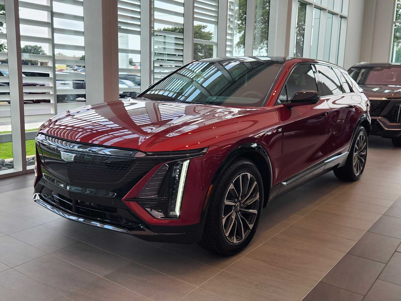 New 2025 Radiant Red Tintcoat Cadillac Sport 1 image 1