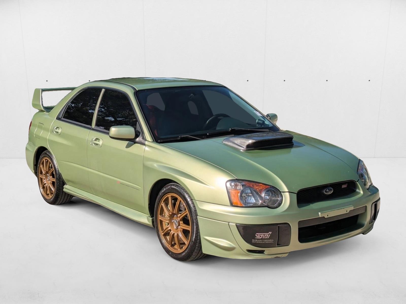Pre-Owned 2004 Subaru Impreza Sedan (Natl) WRX STi w/Gold Wheels