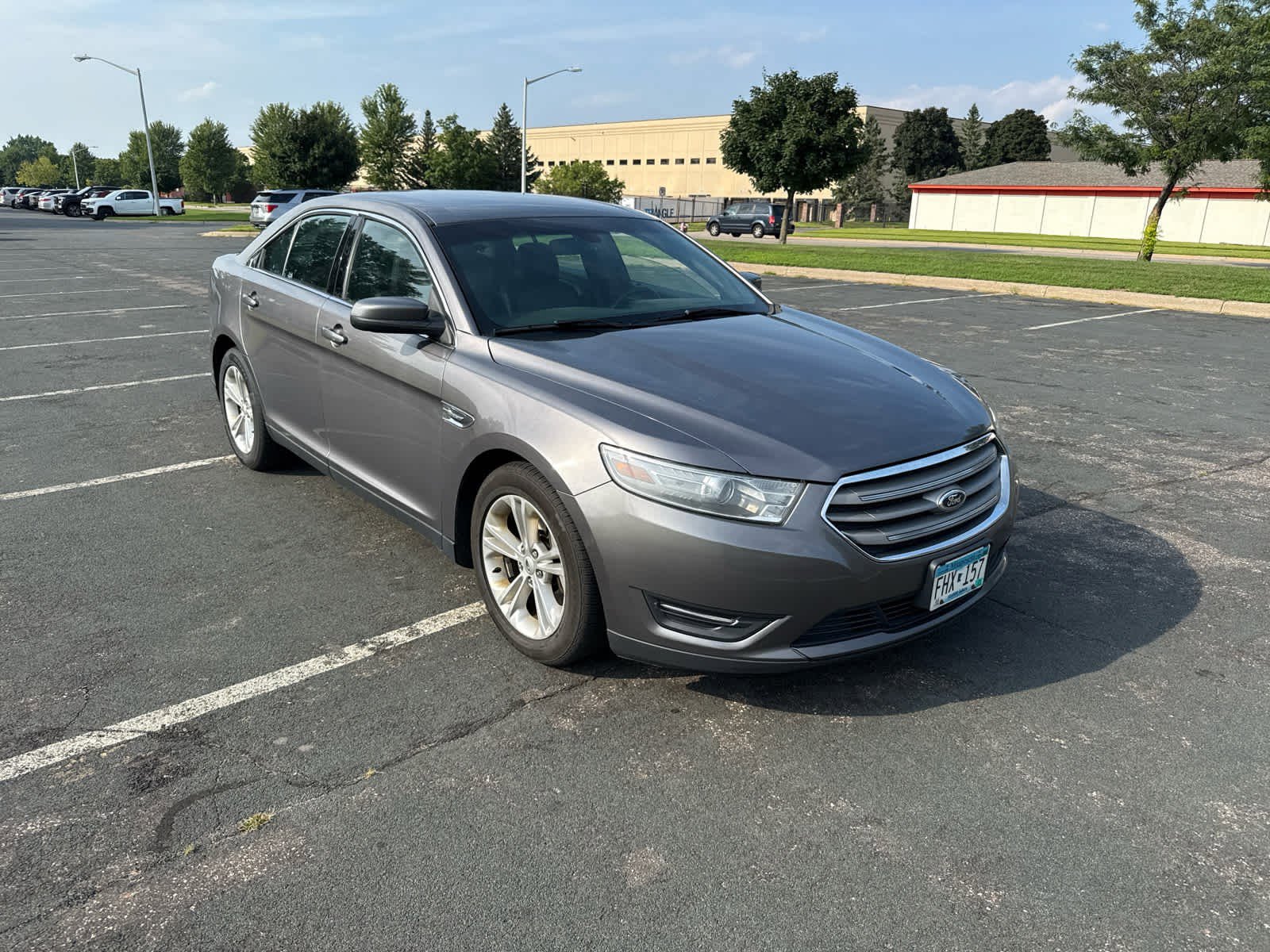 Used 2013 Ford Taurus SEL with VIN 1FAHP2E8XDG192877 for sale in Coon Rapids, Minnesota