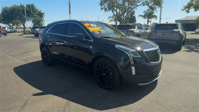 Used 2022 Stellar Black Metallic Cadillac Premium Luxury image 1