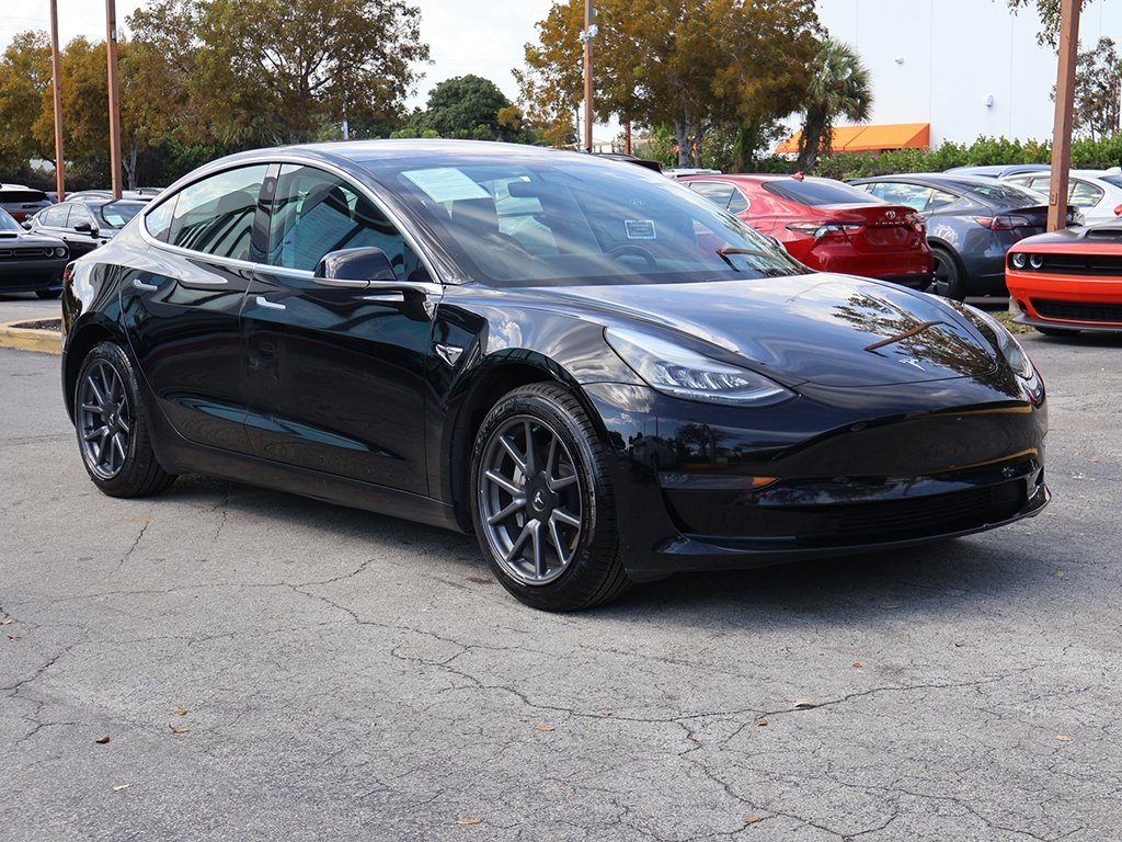 Used 2019 Tesla Model 3 Base with VIN 5YJ3E1EA4KF399957 for sale in Miami, FL