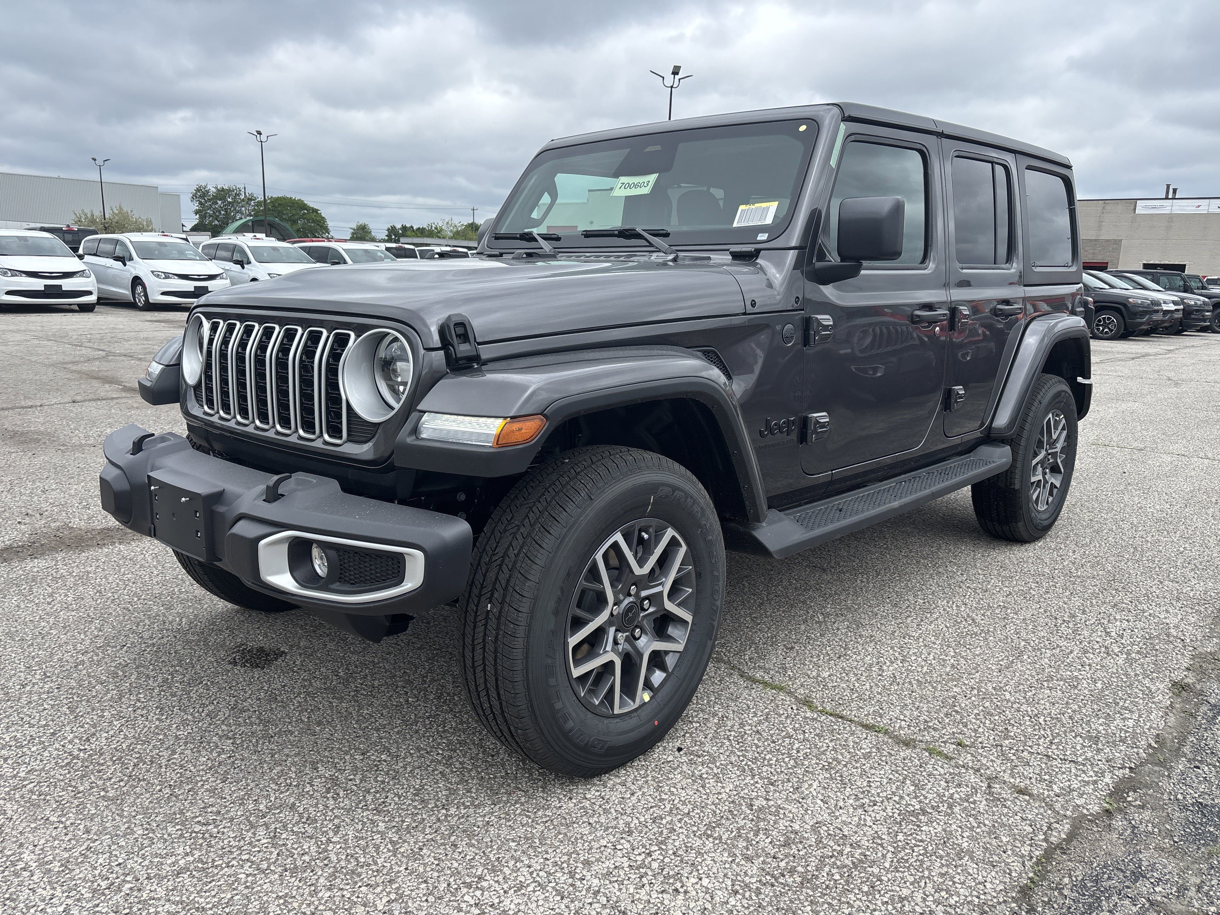 New 2025 Granite Crystal Metallic Jeep Sahara image 1