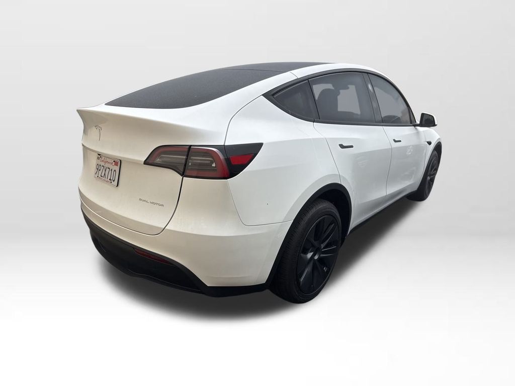 Used 2025 Tesla Model Y Long Range with VIN 7SAYGDEE2SF239261 for sale in Northfield, Minnesota