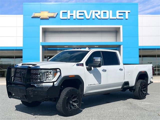 Used 2021 White Frost Tricoat GMC Denali image 1