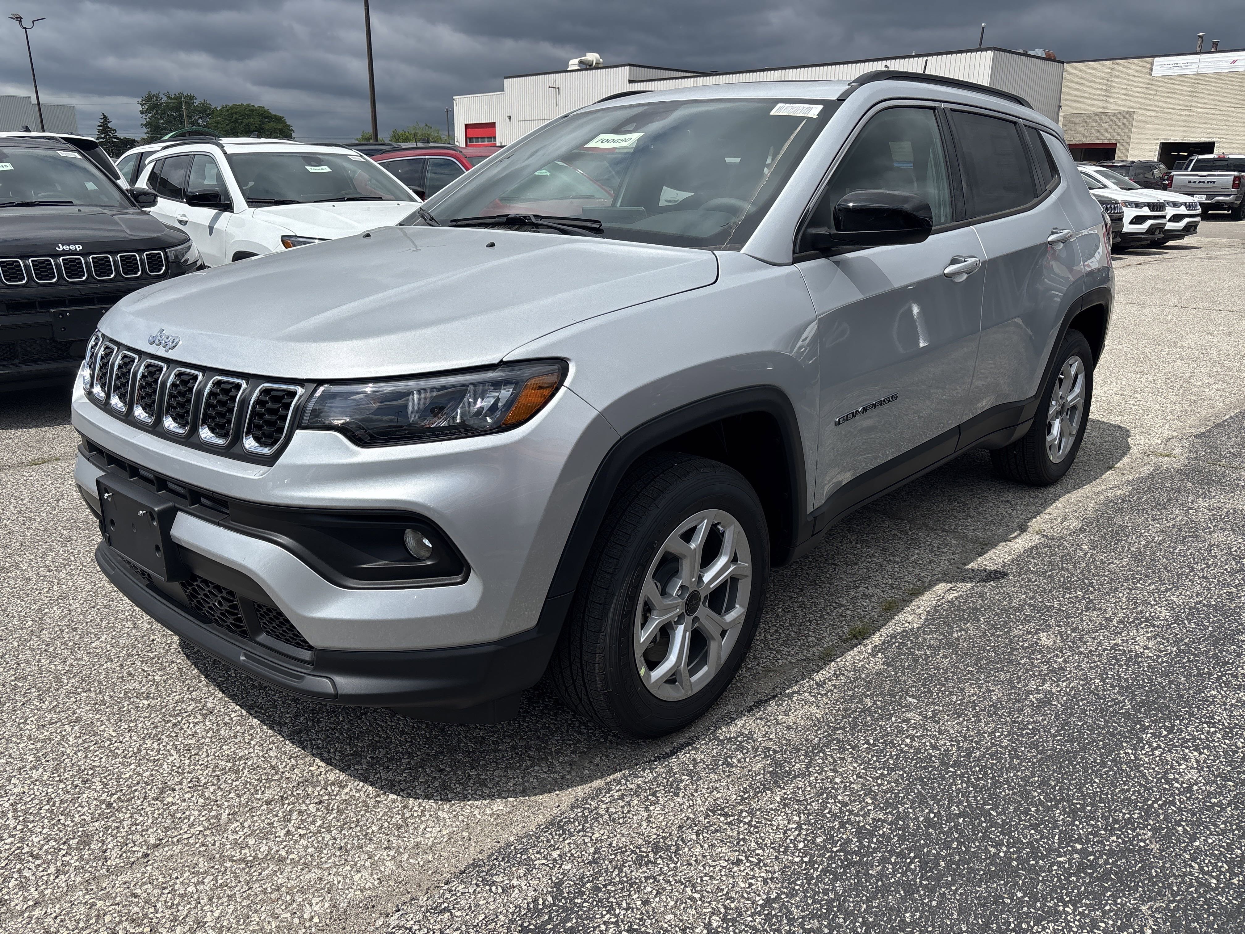 New 2025 Silver Zynith Metallic Jeep North image 1