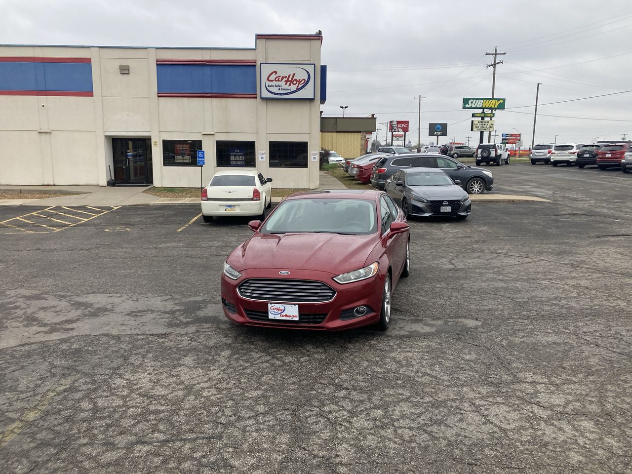 Used 2016 Red Ford SE Sedan 4D image 1