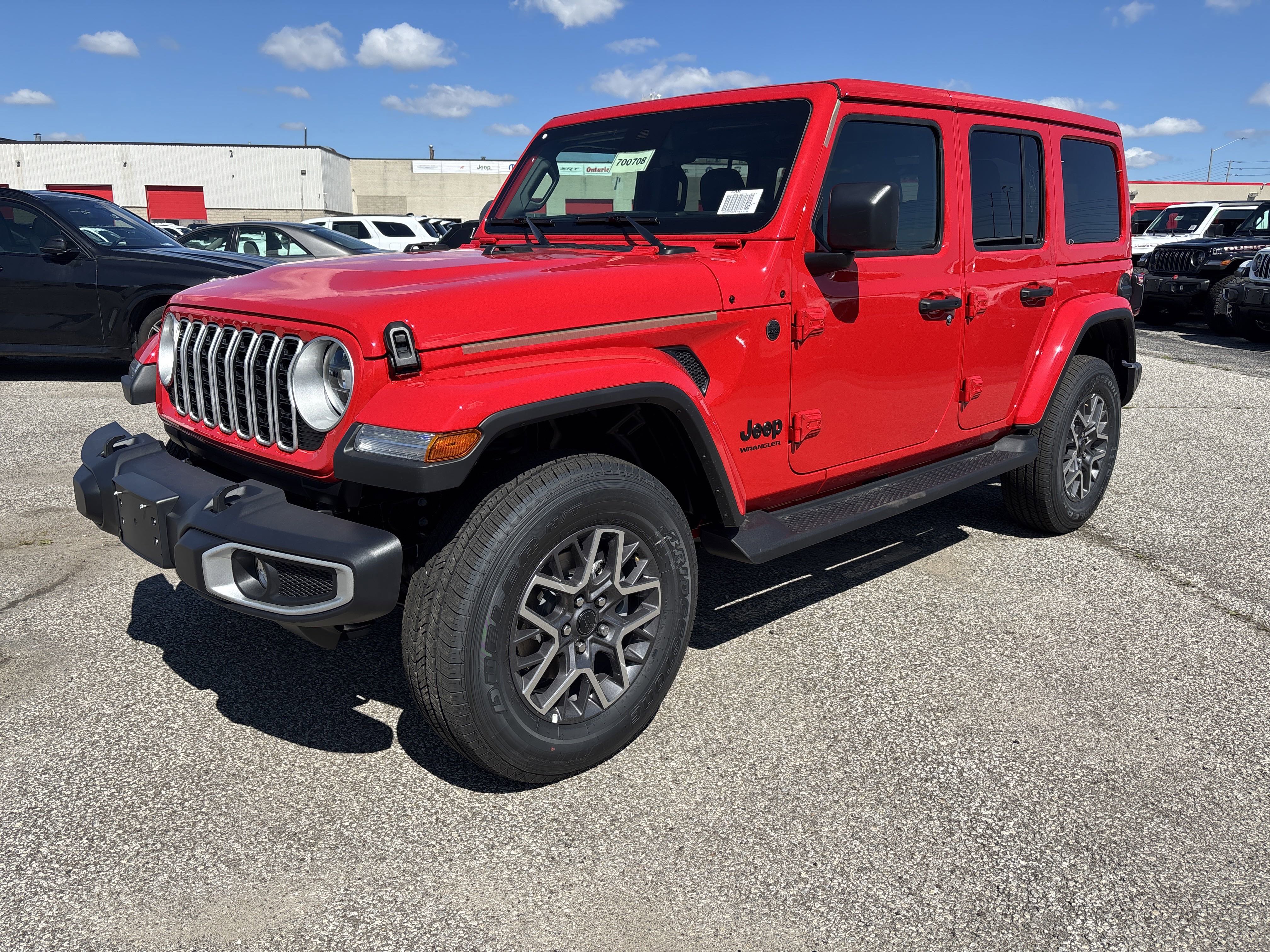 New 2025 Firecracker Red Jeep Sahara image 1