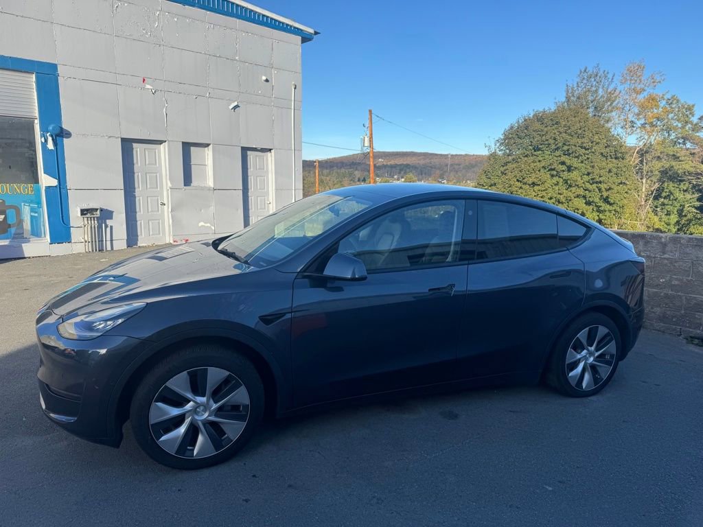 Used 2021 Tesla Model Y Standard Range with VIN 5YJYGDED2MF103834 for sale in Forest City, PA