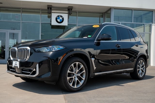 Certified Used 2025 Black Sapphire Metallic BMW xDrive40i image 1