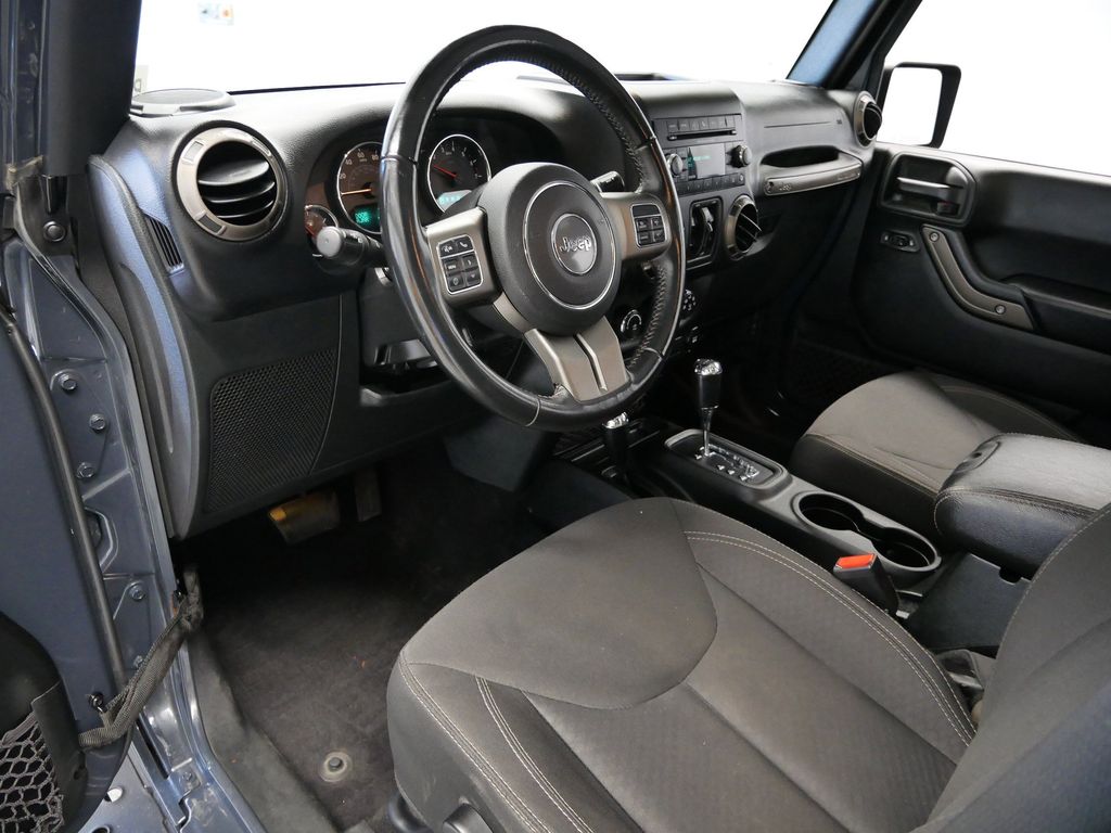 Used 2018 Jeep Wrangler Unlimited Willys Wheeler with VIN 1C4BJWDGXJL857717 for sale in Coon Rapids, Minnesota