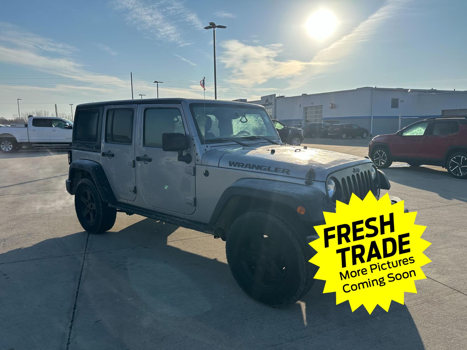 Used 2016 Jeep Wrangler Unlimited Black Bear with VIN 1C4BJWDG4GL167700 for sale in Charles City, IA