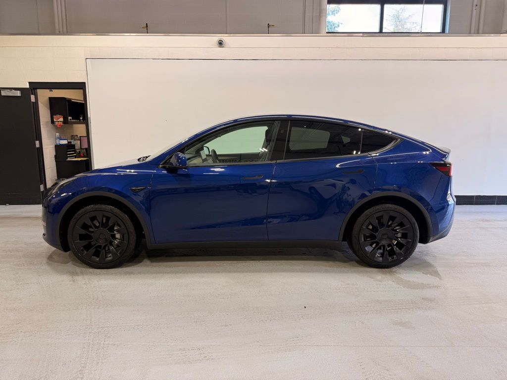Used 2023 Tesla Model Y Long Range with VIN 7SAYGAEE9PF808449 for sale in Golden Valley, Minnesota