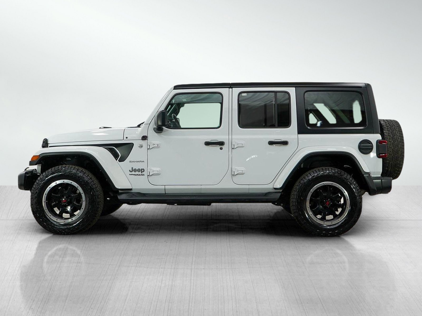 Used 2021 Jeep Wrangler Unlimited Sahara with VIN 1C4HJXEG0MW727611 for sale in Burnsville, Minnesota