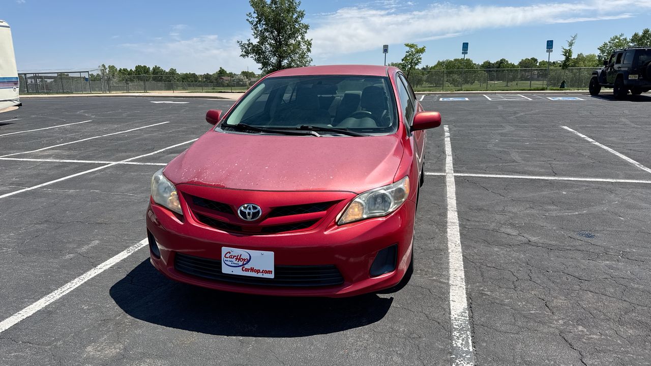 Used 2011 Red Toyota LE image 1