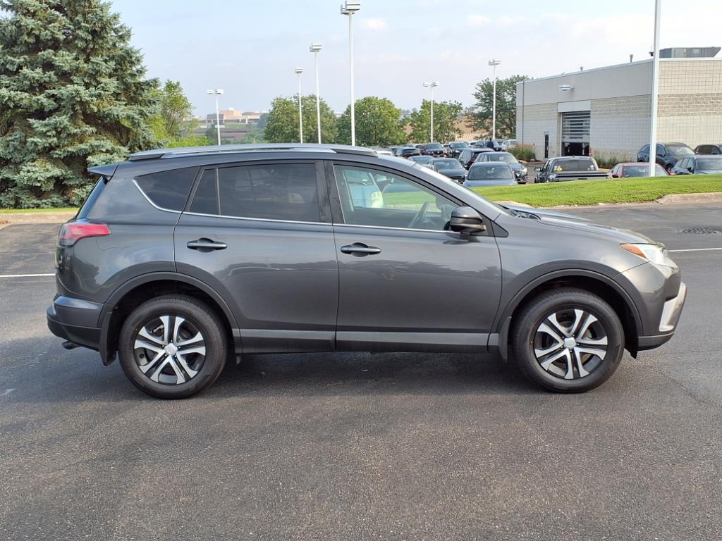 Used 2018 Toyota RAV4 LE with VIN 2T3BFREV9JW765656 for sale in Burnsville, Minnesota