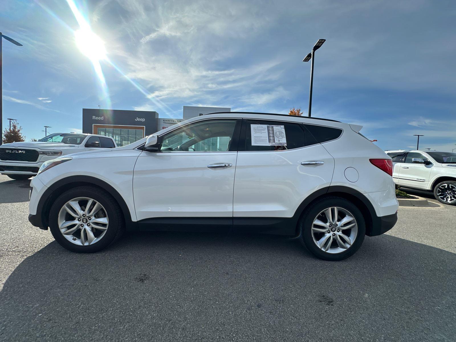 Used 2013 Hyundai Santa Fe Sport 2.0T with VIN 5XYZUDLA0DG013676 for sale in Kansas City
