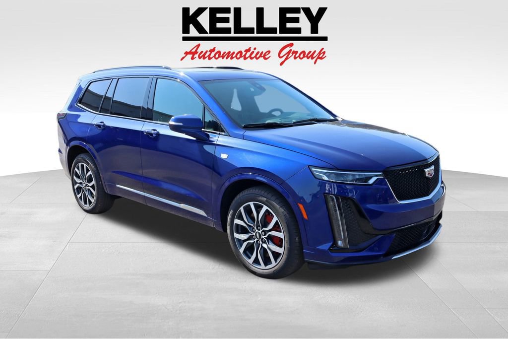 Used 2024 Opulent Blue Metallic Cadillac Sport image 1