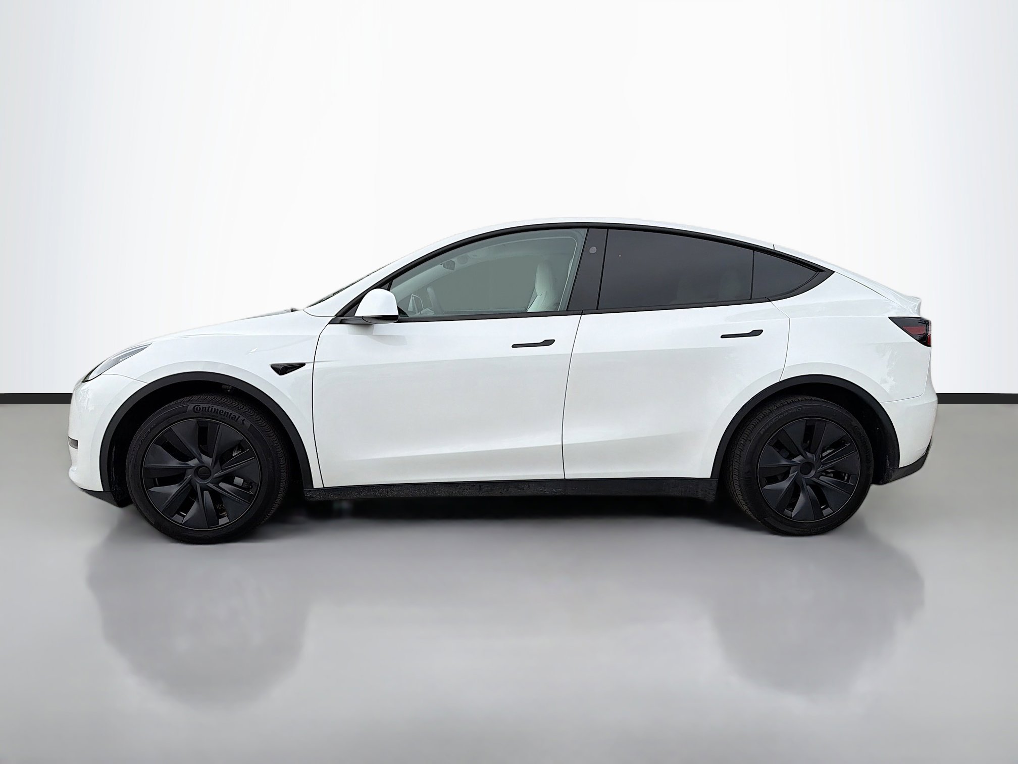Used 2025 Tesla Model Y Long Range with VIN 7SAYGDED1SF235323 for sale in Kansas City