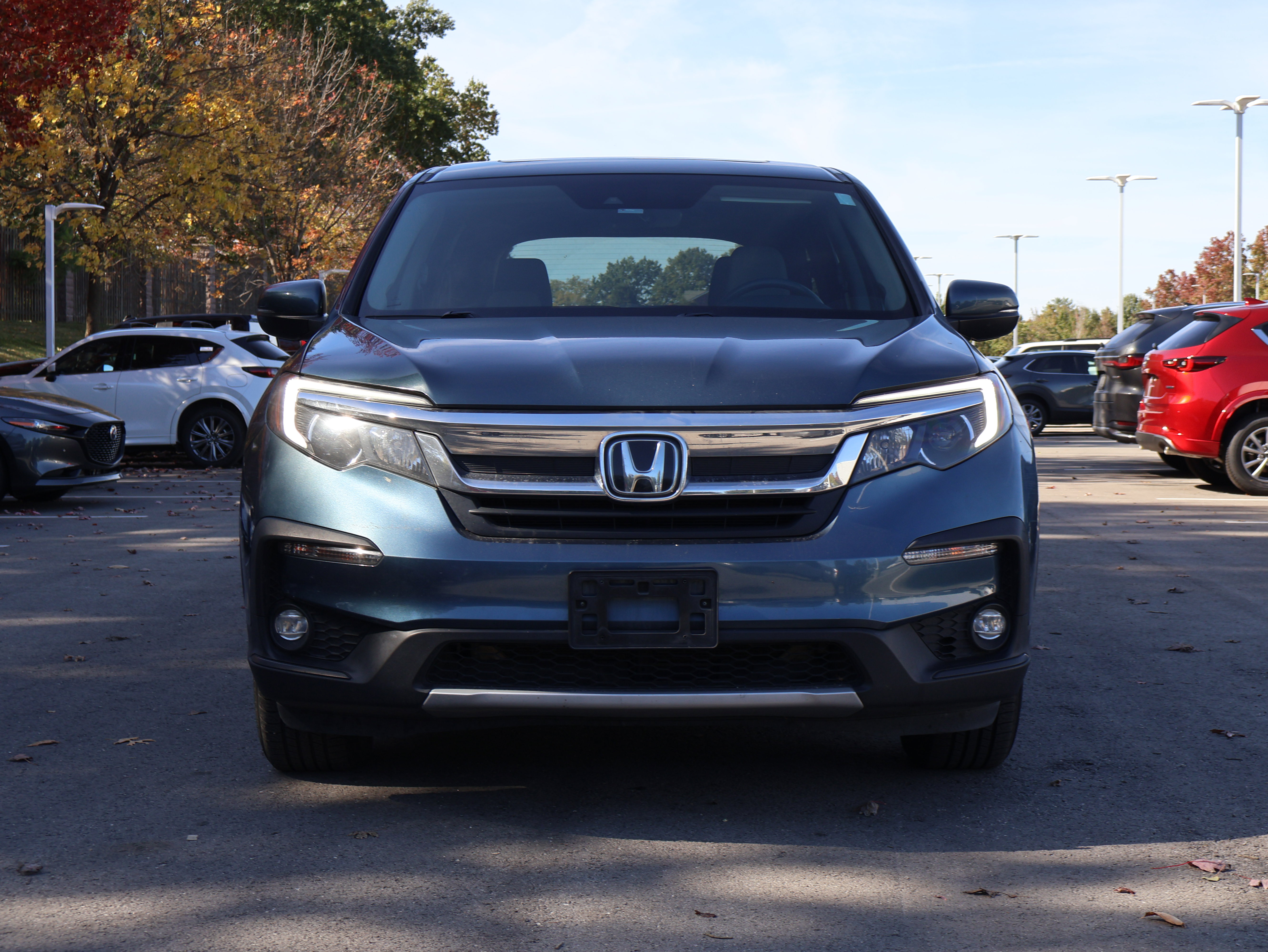 Used 2021 Honda Pilot EX-L with VIN 5FNYF6H56MB031409 for sale in Kansas City