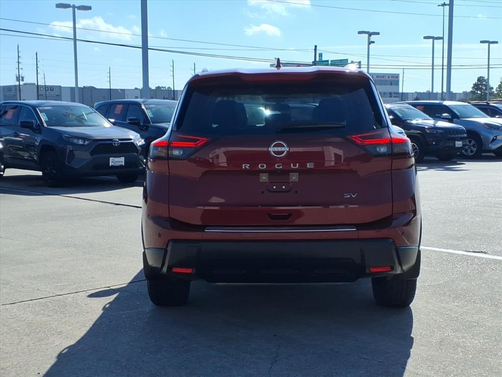 2024 Nissan Rogue SV Red at Robbins Nissan