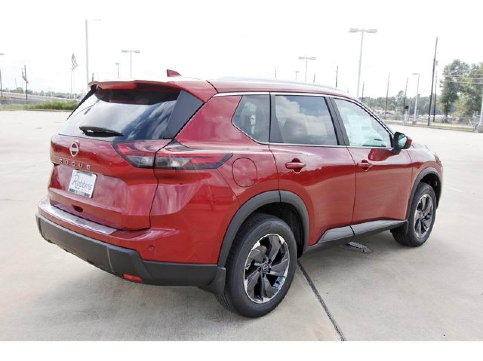 2026 Nissan Rogue SV Red at Robbins Nissan