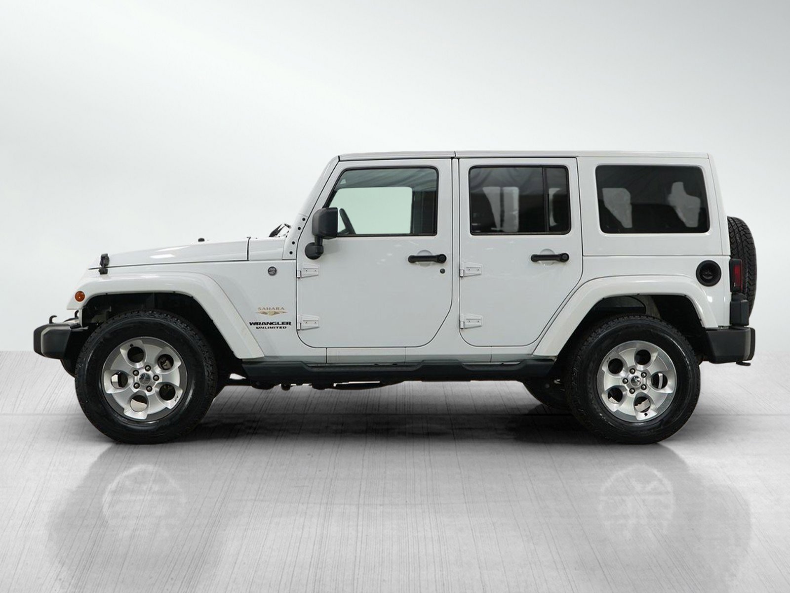 Used 2014 Jeep Wrangler Unlimited Sahara with VIN 1C4BJWEG6EL255899 for sale in Burnsville, Minnesota