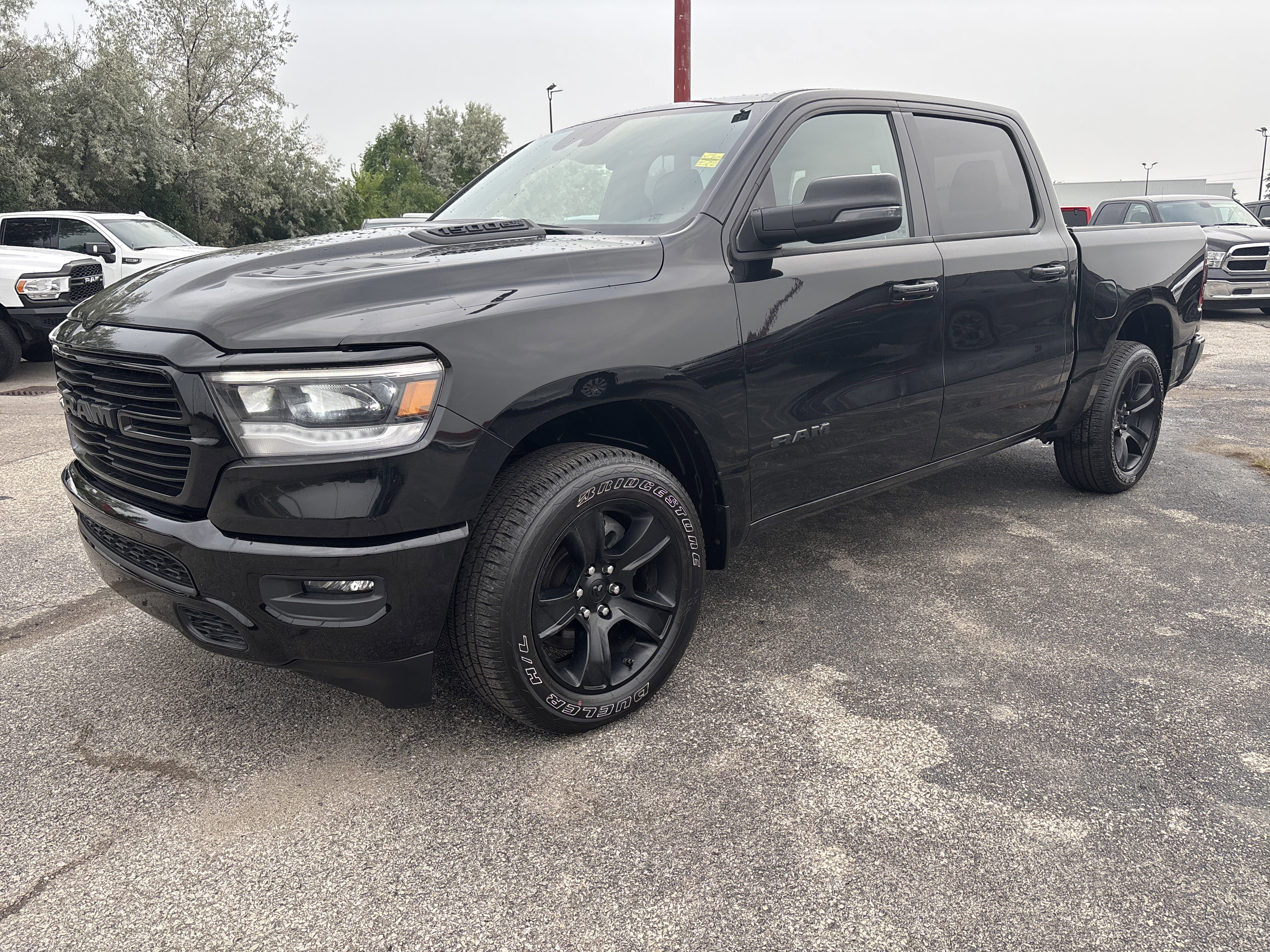 Used 2023 Diamond Black Crystal Pearl Ram Sport image 1