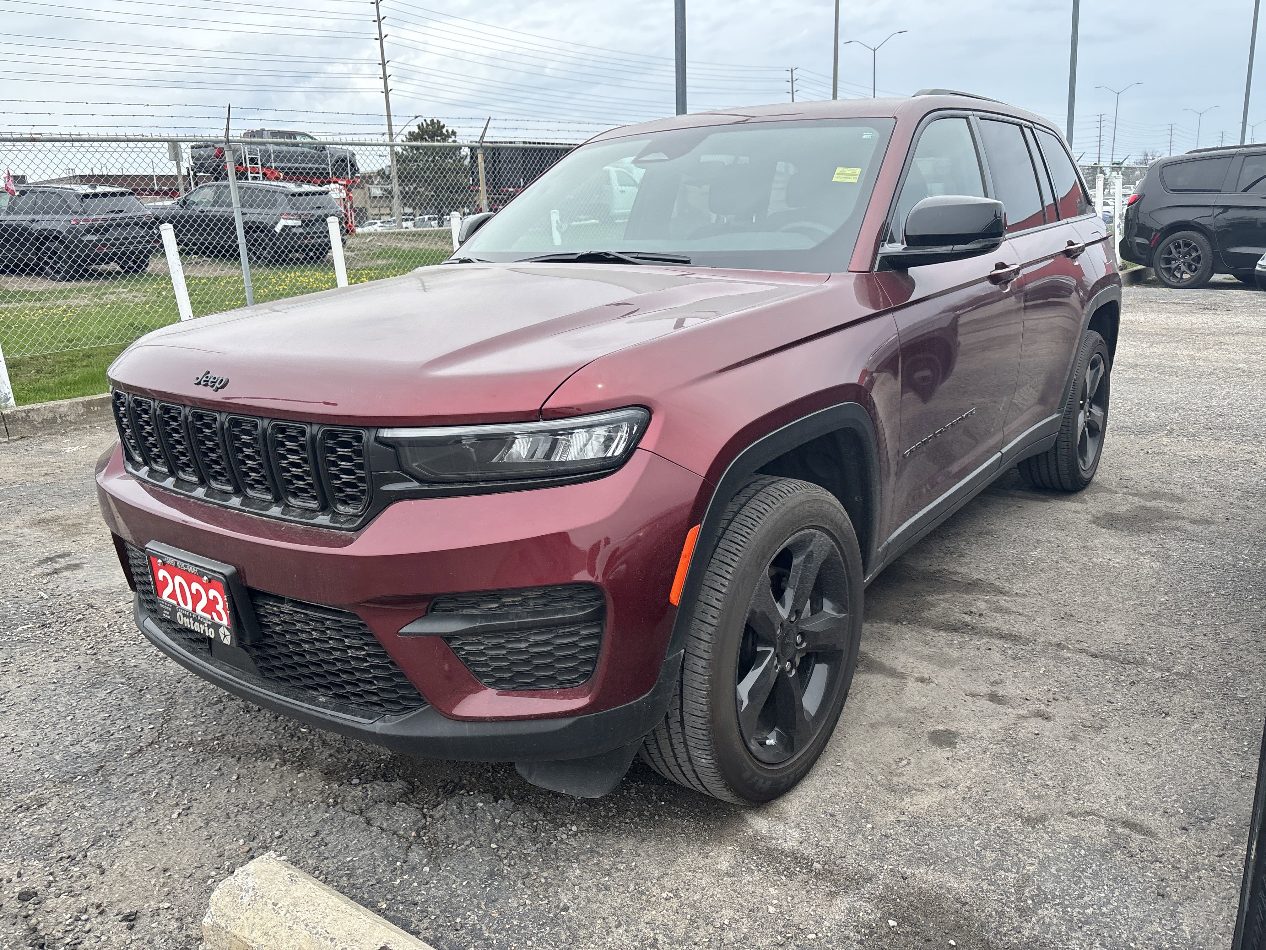 Used 2023 Velvet Red Pearl Jeep Altitude image 1