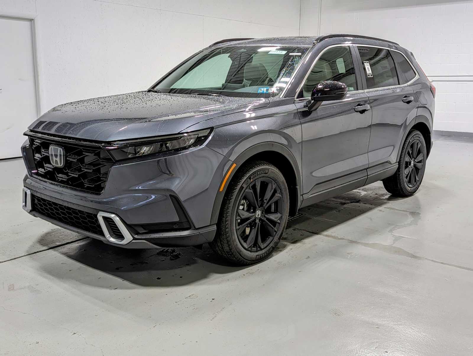 New 2024 Honda CRV HYBRID AWD SP TRG in Meteorite Gray Metallic