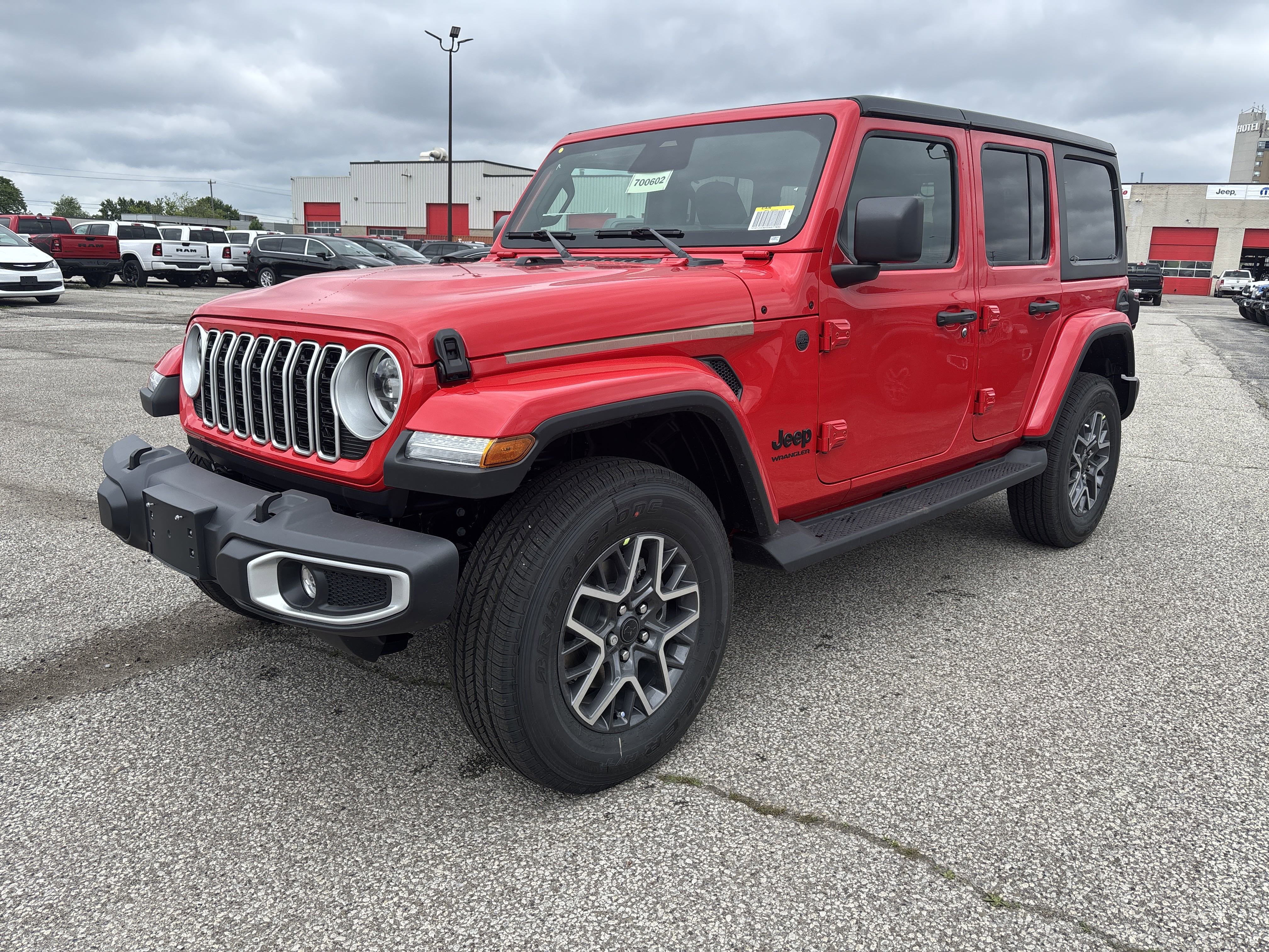 New 2025 Firecracker Red Jeep Sahara image 1